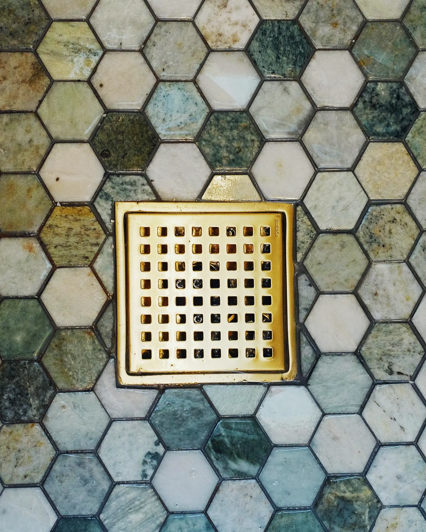 Hexagon mosaic shower floor with drain installed in an El Paso, TX bathroom