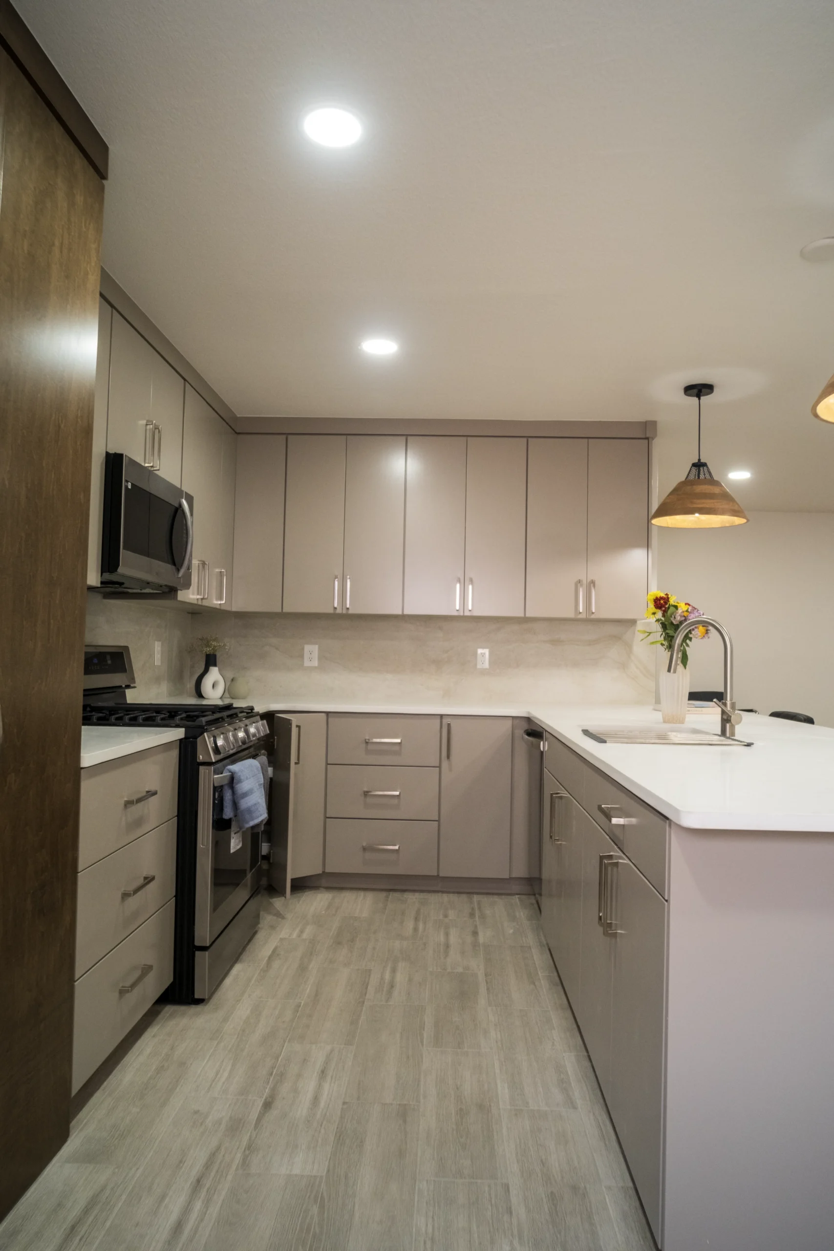 Kitchen with light wood-look plank flooring installed in an El Paso, TX home