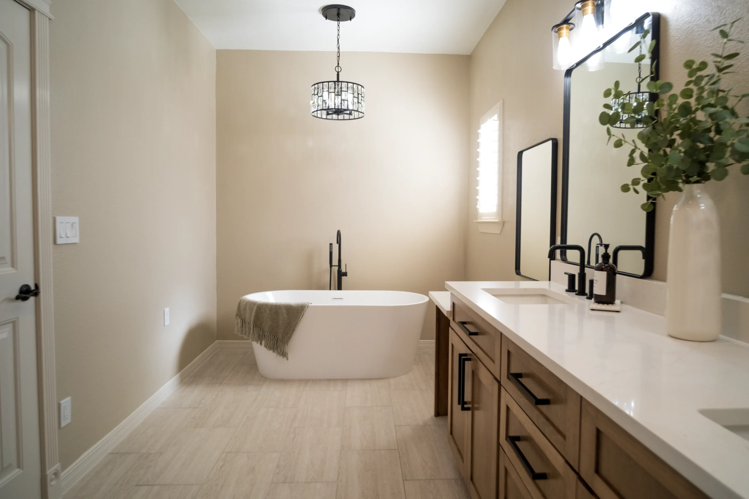 Bathroom with freestanding tub and tile flooring installed in an El Paso, TX home