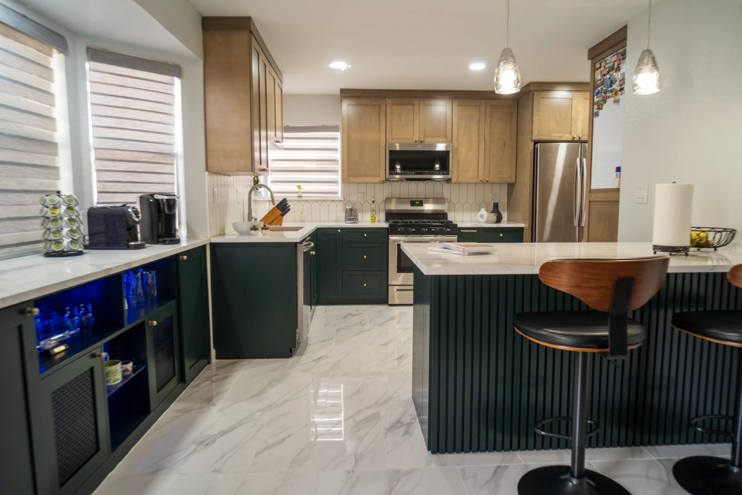 Kitchen and island with wood-look plank flooring installed in an El Paso, TX home