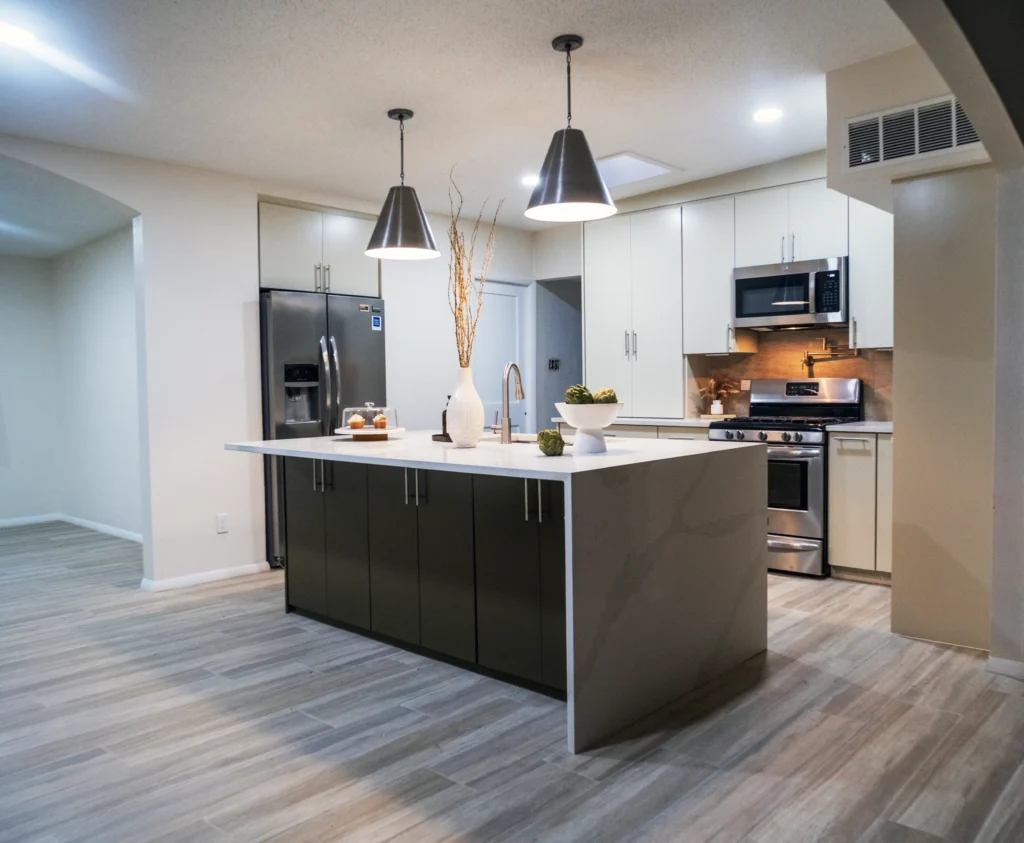 Modern kitchen with wood-look plank flooring installed in an El Paso, TX home