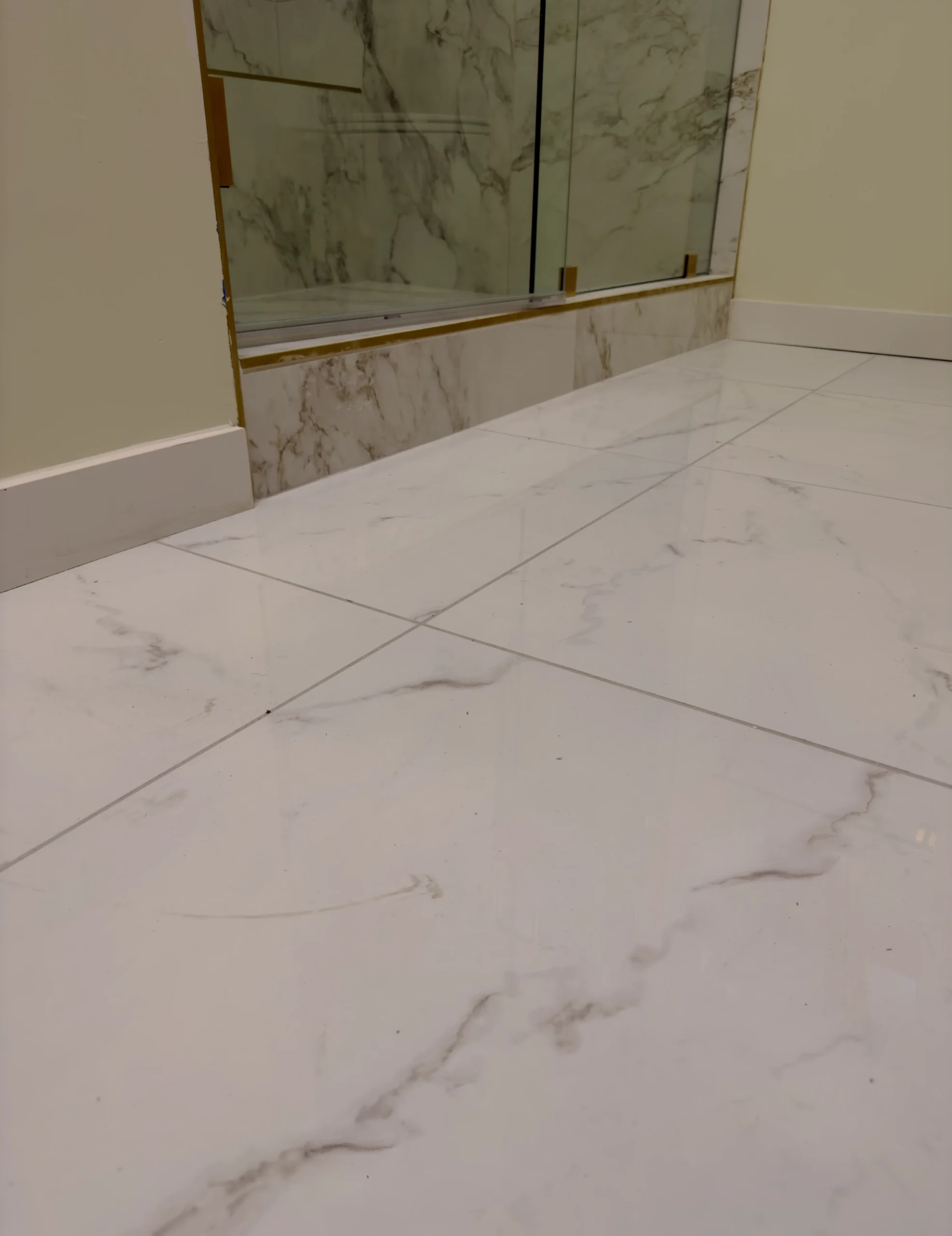 Marble tile shower floor installed in an El Paso, TX bathroom